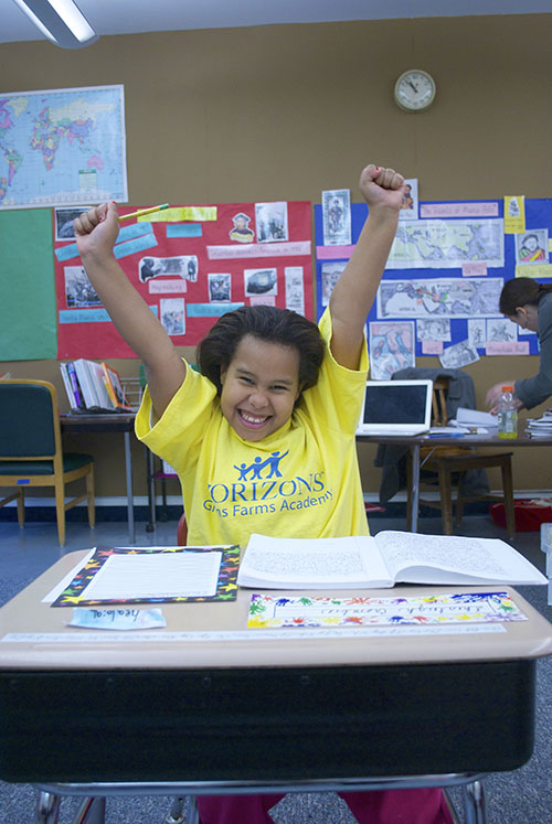 Smiling child in Horizons t-shirt